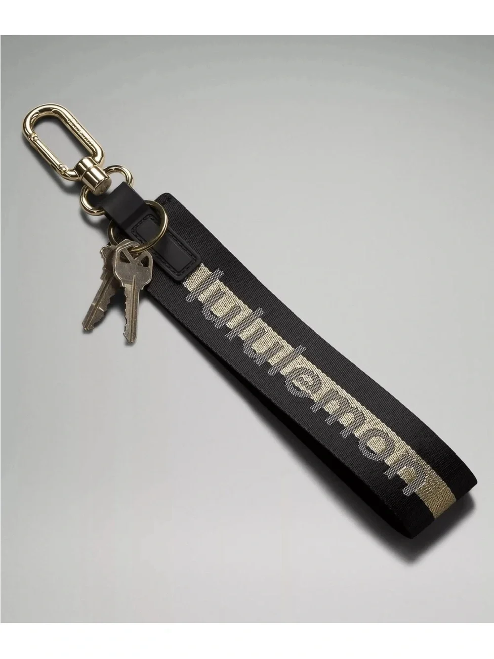 NWT Never Lost Keychain Black/ Gold Wordmark O/S